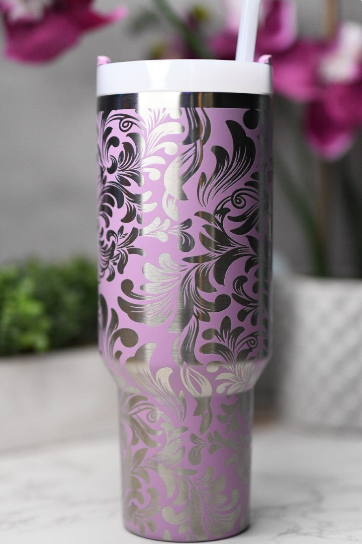 a cup with a straw in it sitting on a table