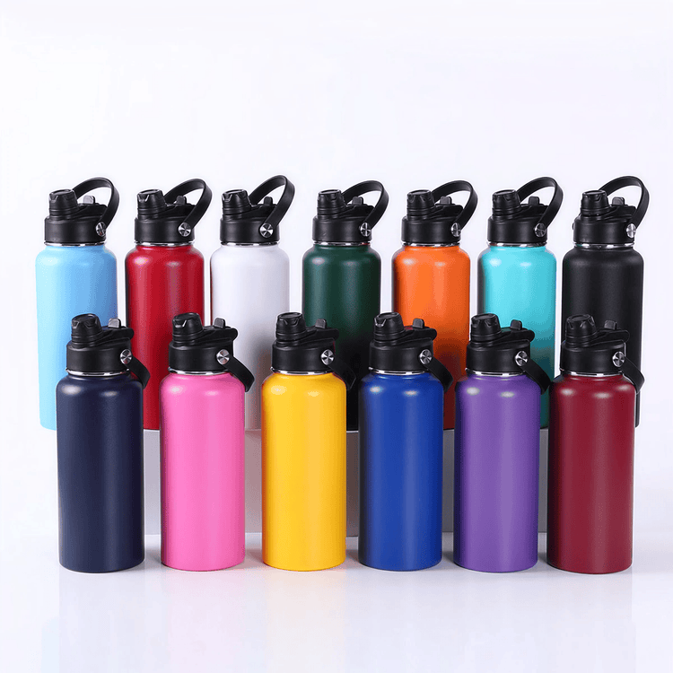 Assorted 32 oz water bottles standing together in multiple colors.