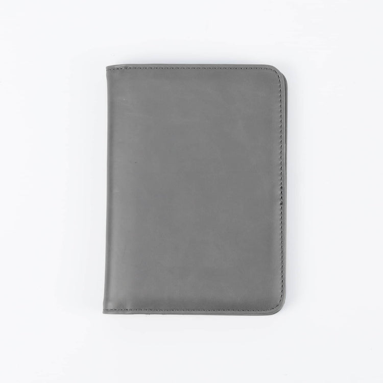 Gray passport wallet shown closed against white.