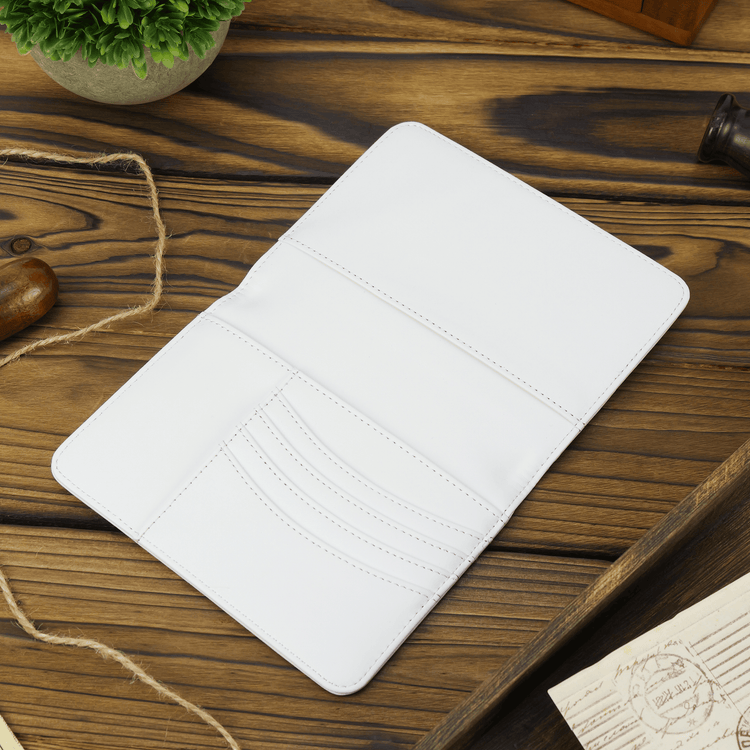 White passport wallet open to show the curved card slots.