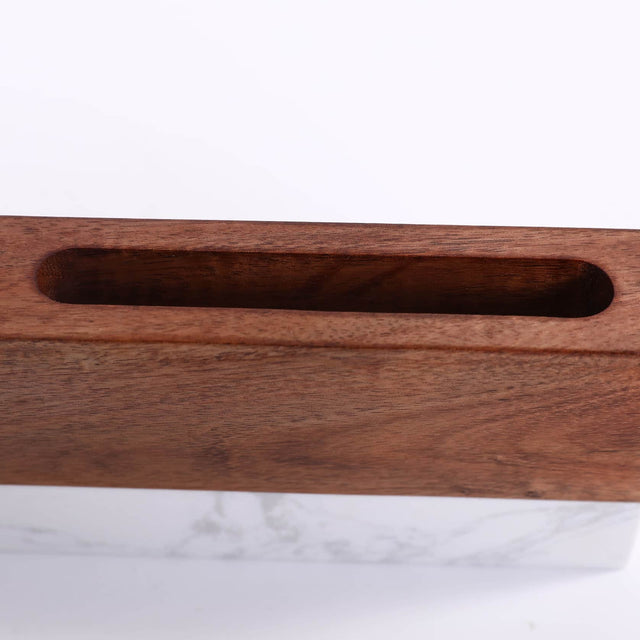 Close-up of the wood organizer’s card slot and two pen openings.