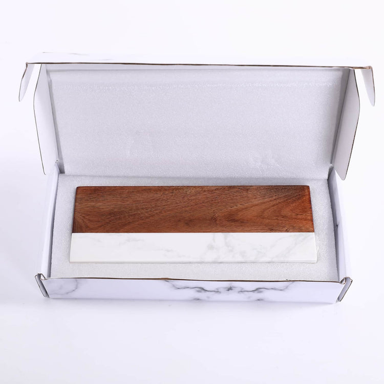 Side view of the marble and acacia desk organizer against white.