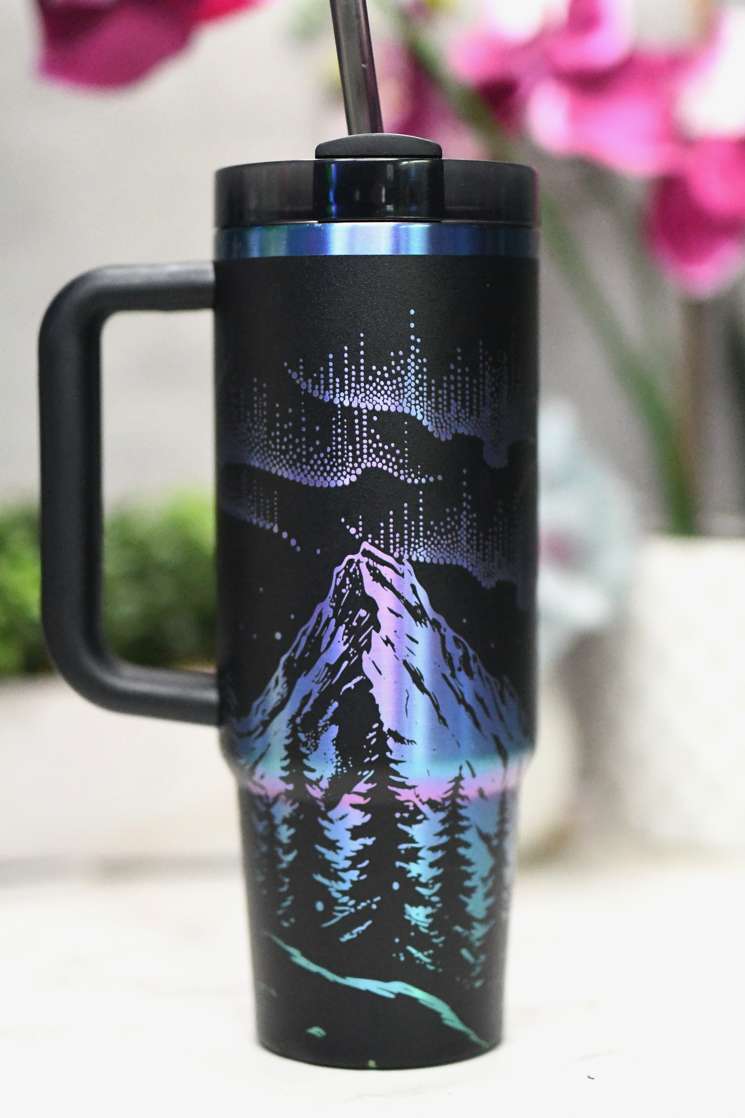 a cup with a straw in it sitting on a table