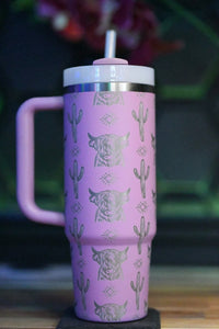 a pink coffee cup with a cactus pattern on it