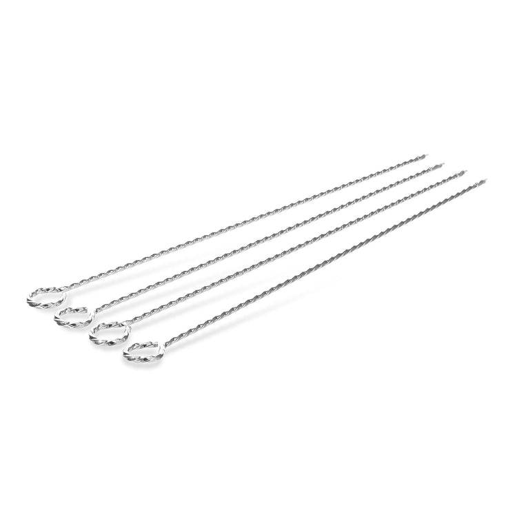 Set of four stainless steel barbecue skewers against white.