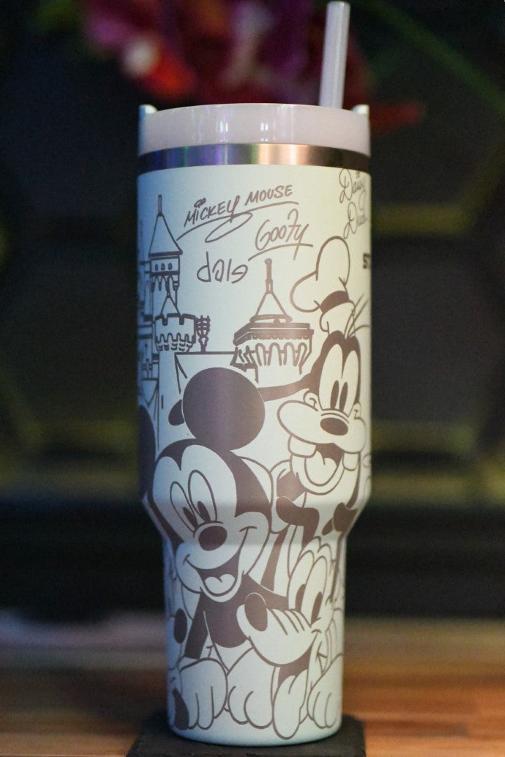 a mickey mouse cup with a straw sticking out of it