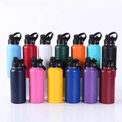 Assorted 32 oz water bottles standing together in multiple colors.