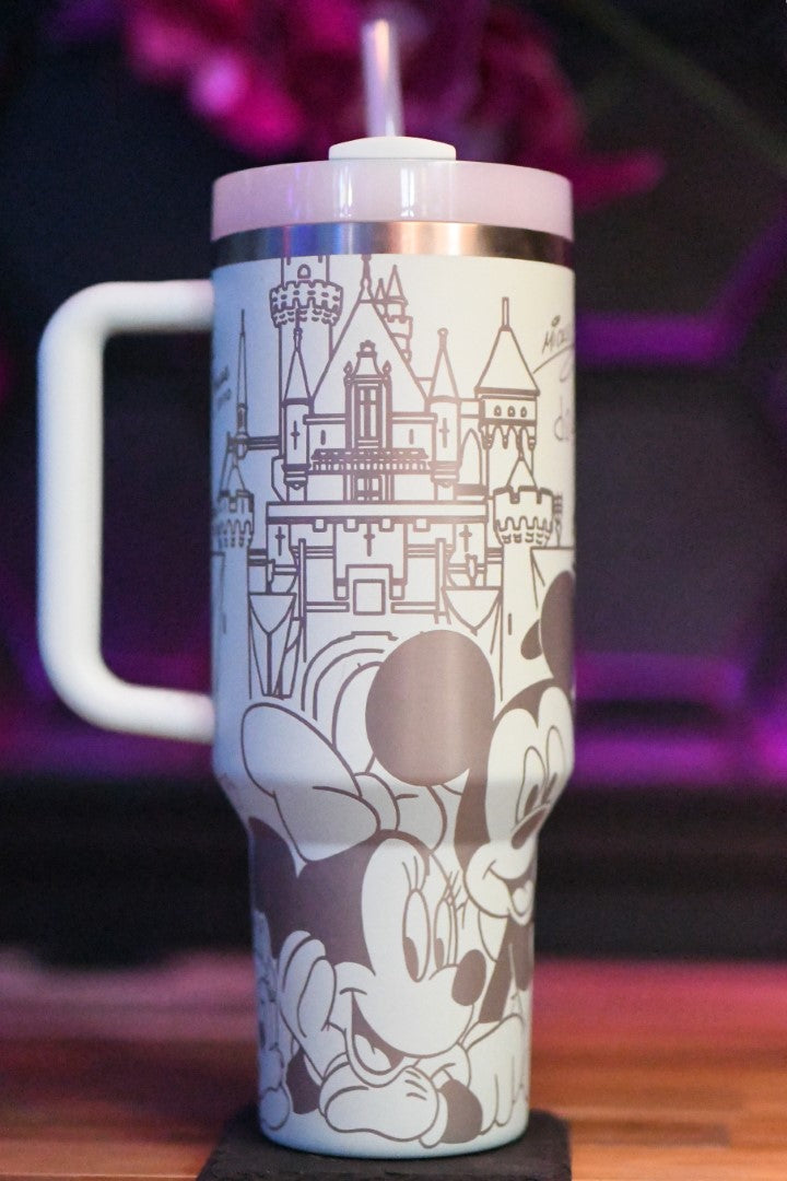 a cup with a mickey mouse design on it