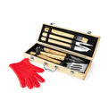 Open barbecue tool case with utensils and red heat-resistant glove.
