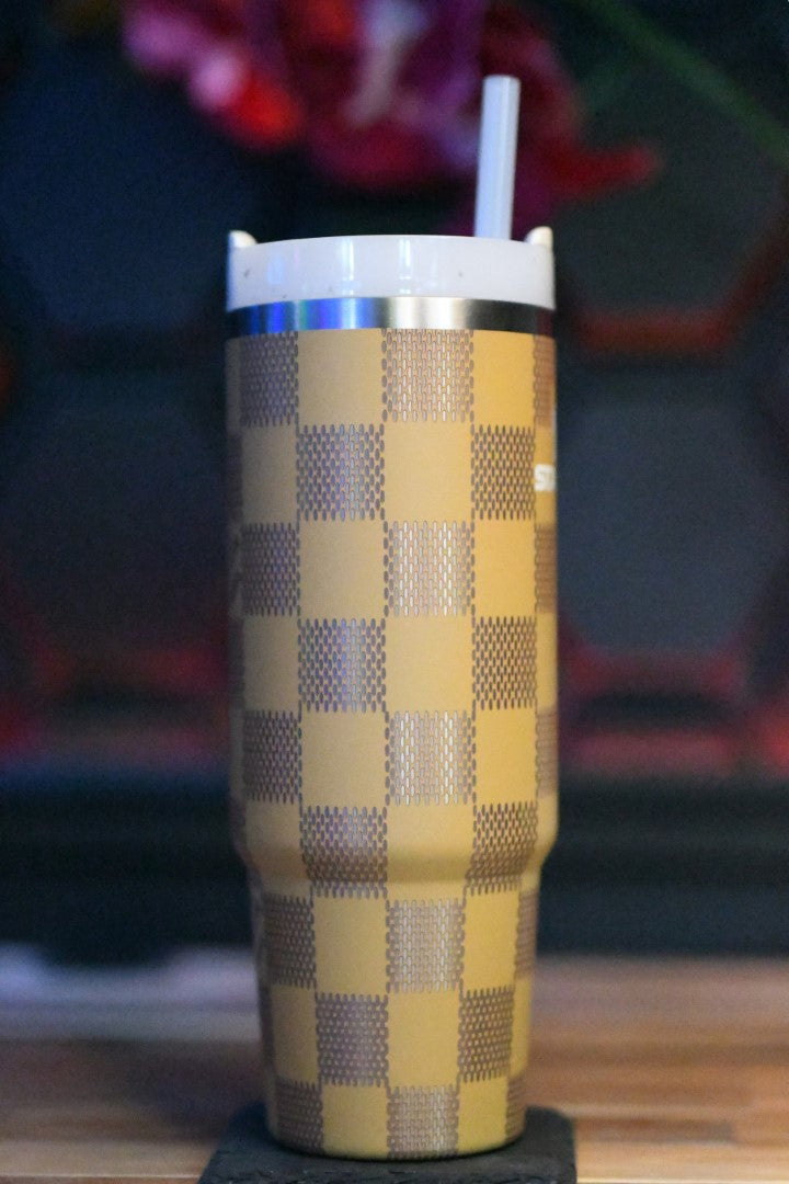 a cup with a straw sticking out of it