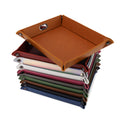Stack of assorted valet trays with a rawhide tray on top.