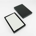Silver journal notebook shown closed with cover and page details.