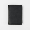 Black passport wallet shown closed against white.