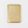 Gold passport wallet shown closed against white.