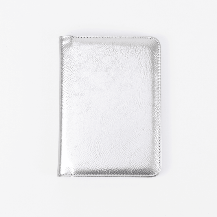Silver passport wallet shown closed against white.