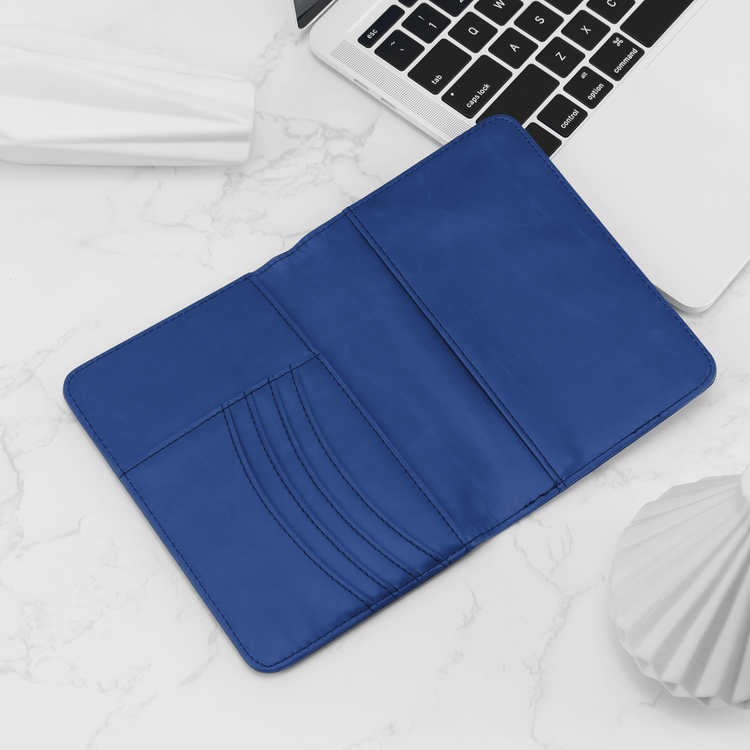 Blue passport wallet open to show the curved card slots.