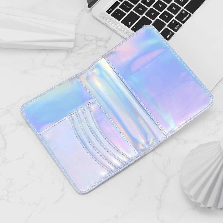 Holographic passport wallet open to show card slots and passport pocket.