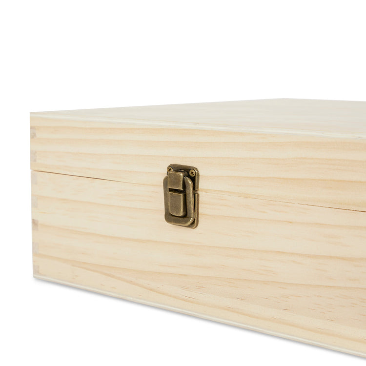 Close-up of the locking clasp on a large natural wood box.