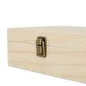 Close-up of the metal clasp on a natural wood memory box.