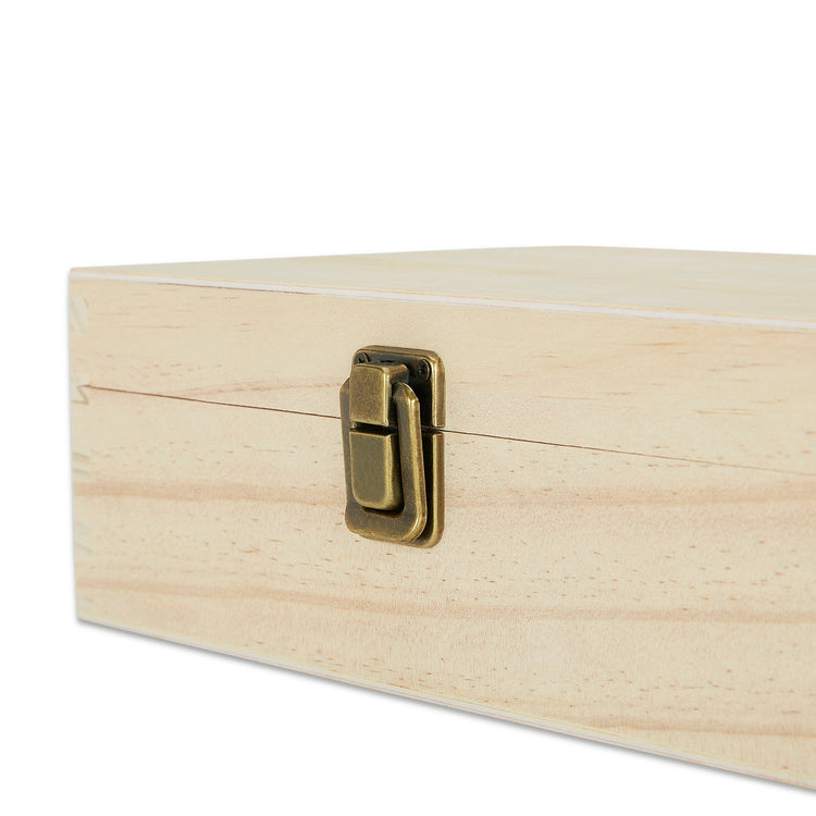 Close-up of the metal clasp on a natural wood memory box.