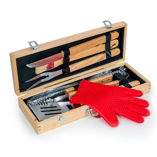 Eleven-piece barbecue tool set arranged in its open wooden case.