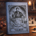 Black engraved journal featuring a detailed portrait design on the cover.