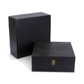 Large black memory box displayed with its presentation box.