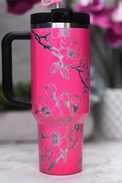 a pink coffee cup with a black handle