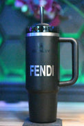 a black coffee mug with the word fendi on it