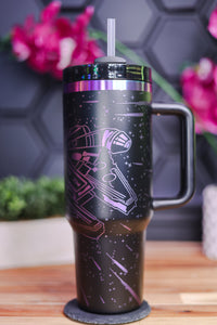 a travel mug with a star wars scene on it