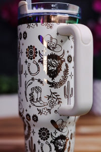 a white coffee cup with a design on it