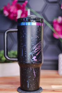 a black travel mug with a pink star design on it