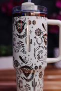 a white coffee cup with a cactus design on it