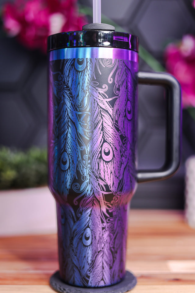 a purple and blue coffee cup with a straw in it