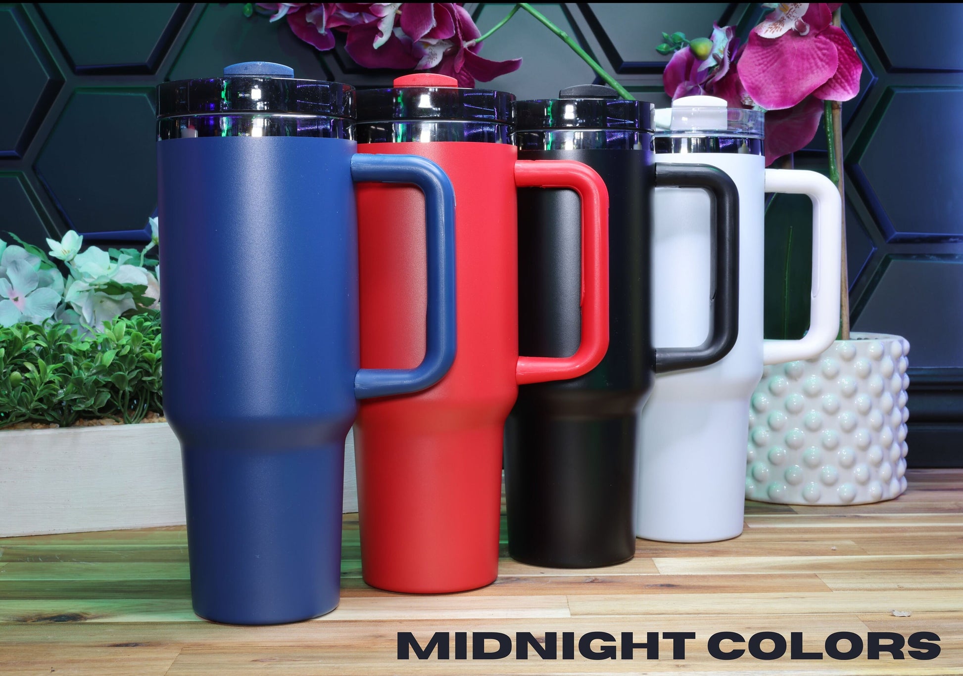 a group of different colored cups sitting next to each other