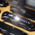 Pocket Knives — Metal Pocket Knife Being Engraved
