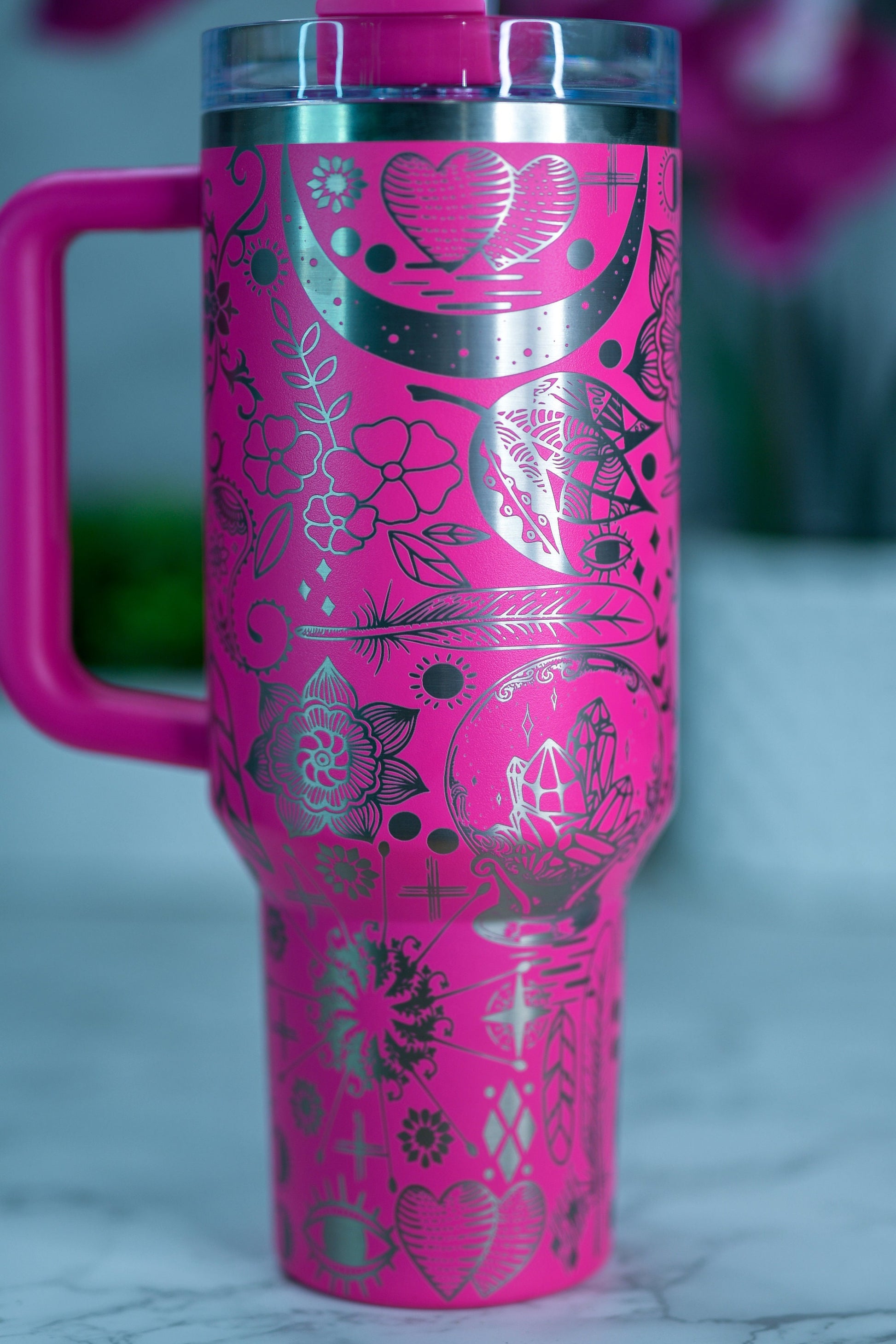 a pink travel mug with a pink handle